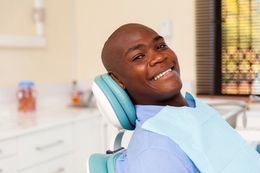 Young woman visiting doctor for teeth whitening