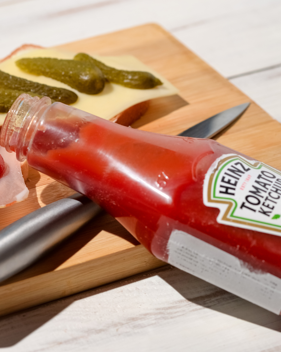 Heinz ketchup bottle on cutting board