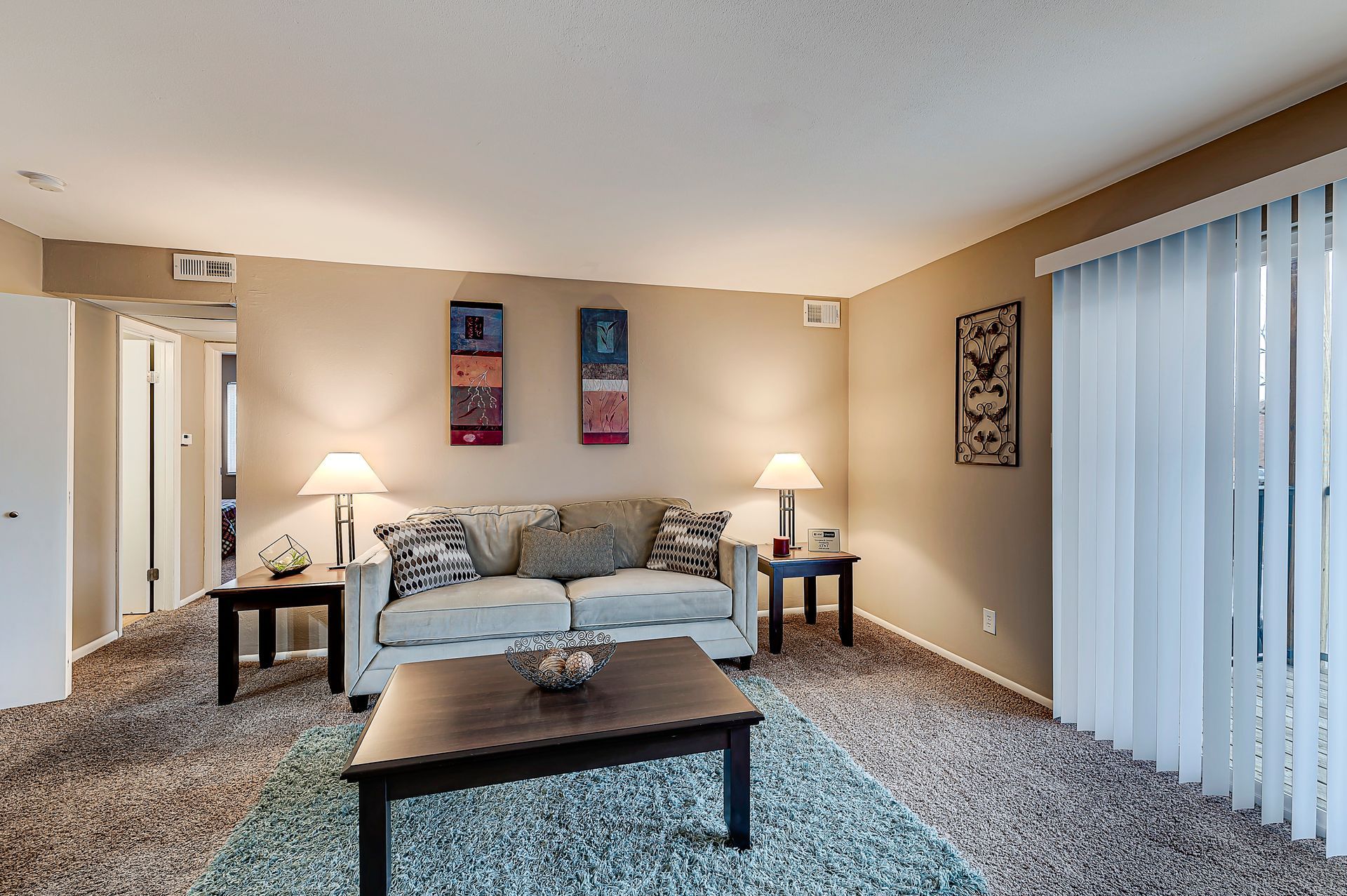 Aspen Pointe Apartment living room couch and art