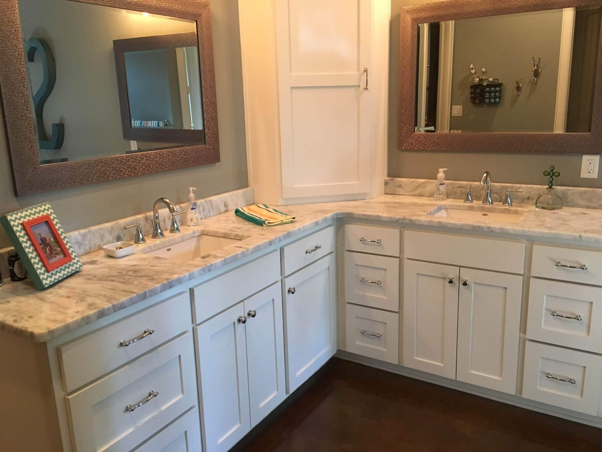 A bathroom with two sinks and two mirrors.