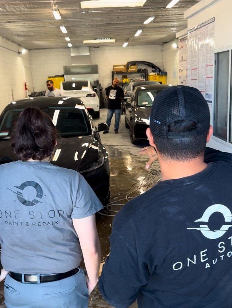 Two people in grey shirts with logo 