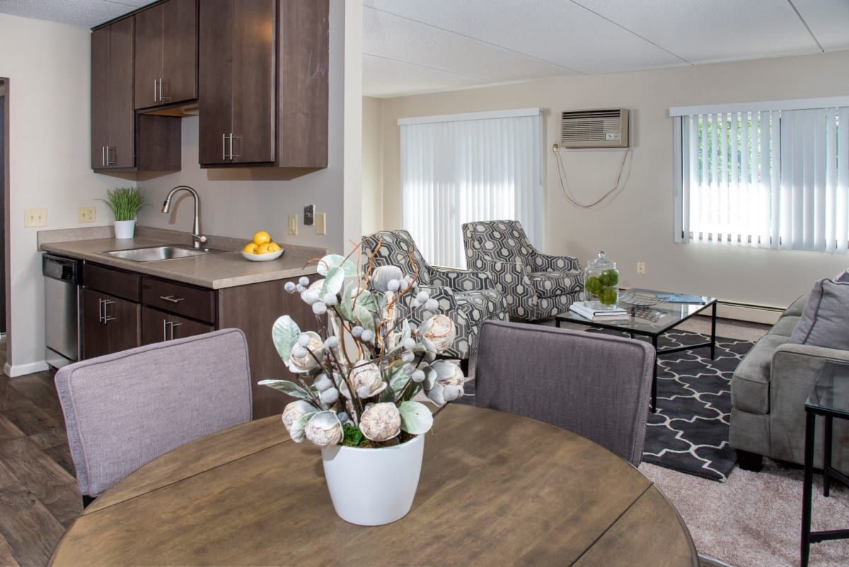 There is a vase of flowers on the table in the living room.