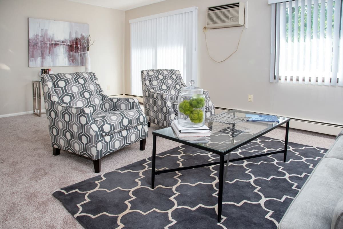 A living room with two chairs and a coffee table