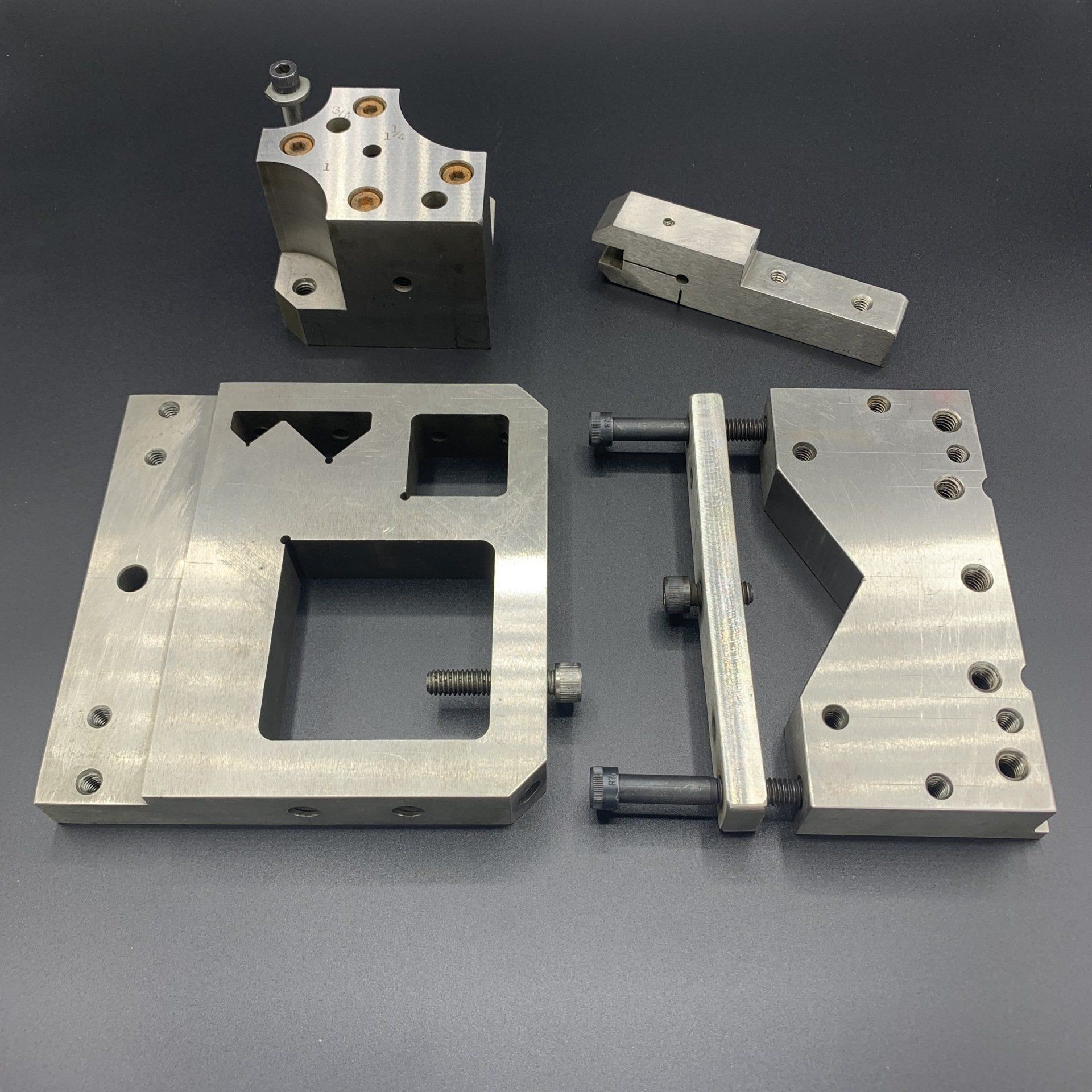 A bunch of metal parts are sitting on top of each other on a table.