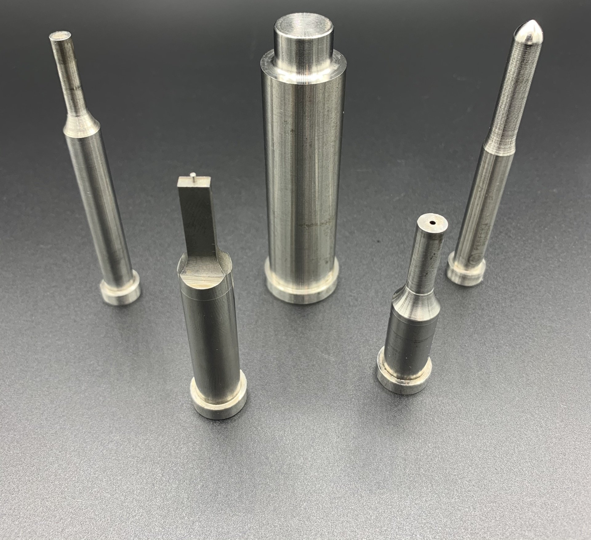 A group of metal pieces are sitting on top of each other on a table.