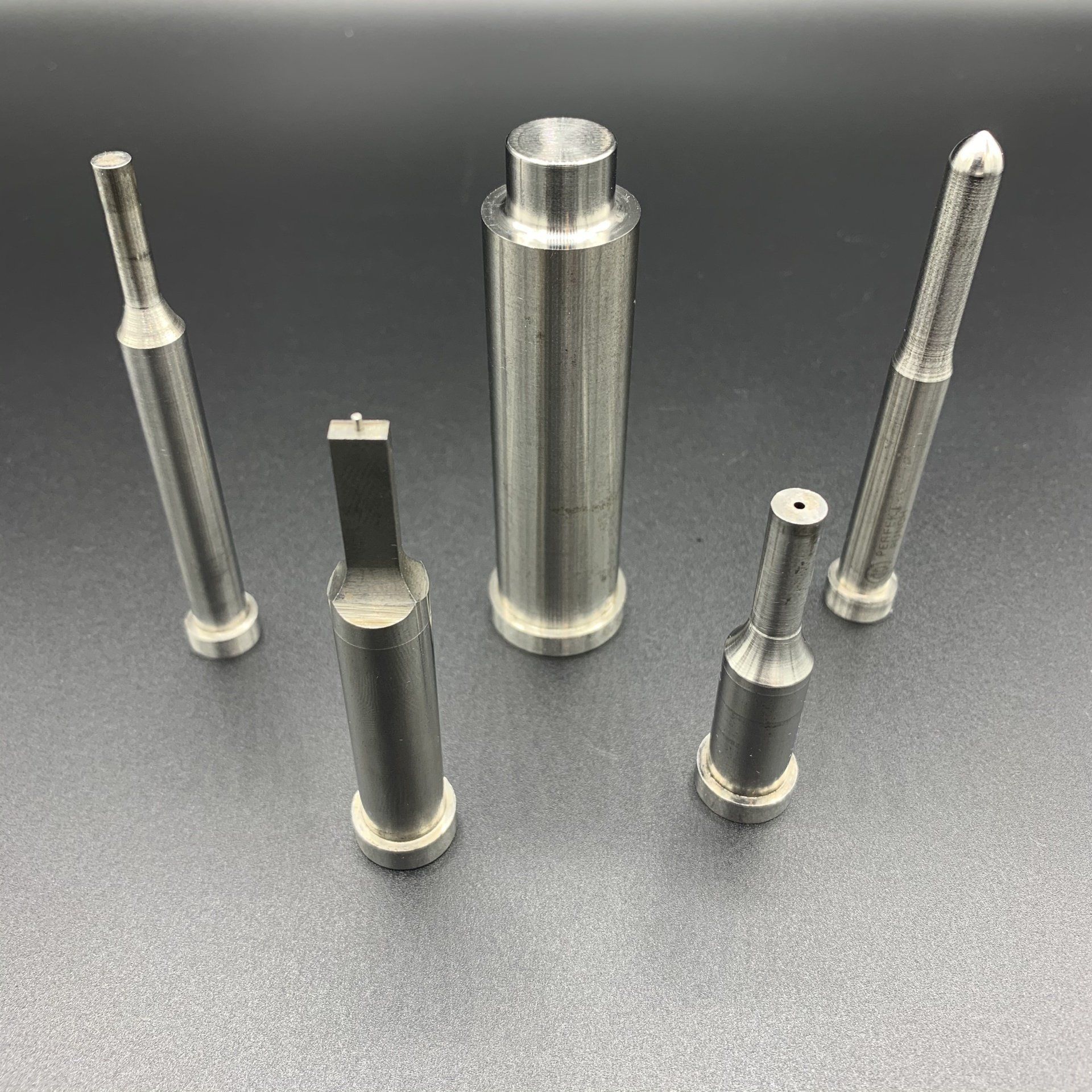 A group of metal pieces are sitting on top of each other on a table.