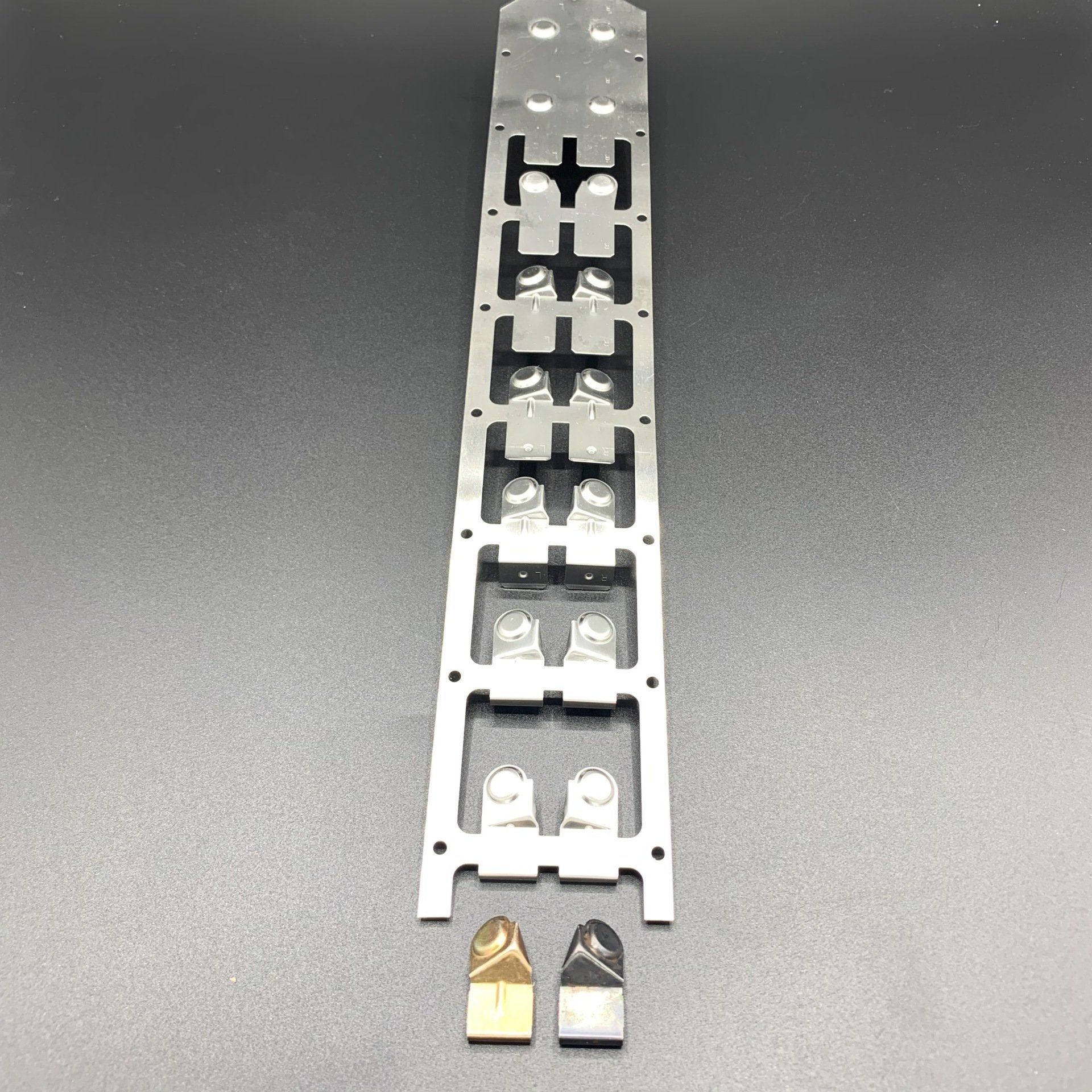 A metal item with holes in it is sitting on a table.