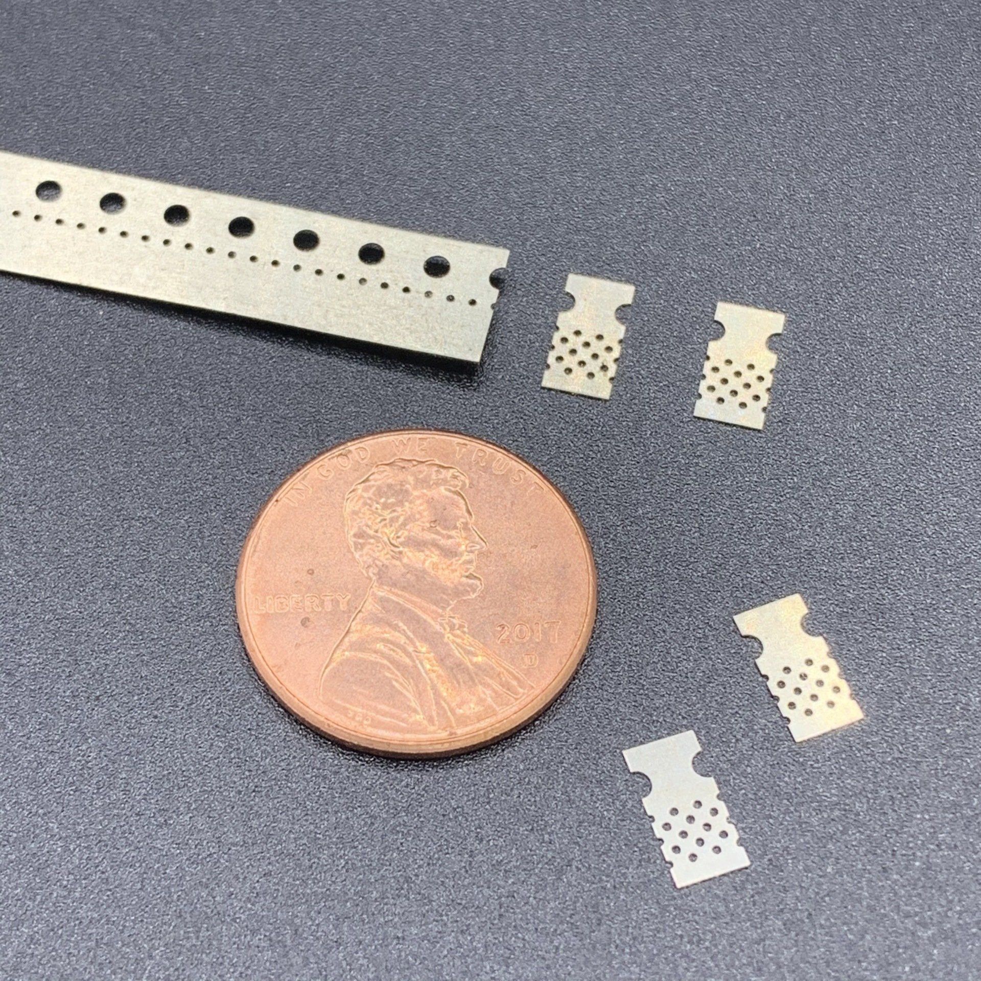 A penny is sitting next to a ruler on a table