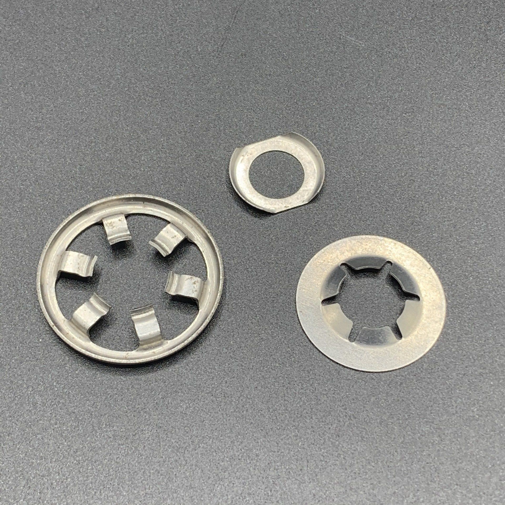 There are three different types of washers on the table.