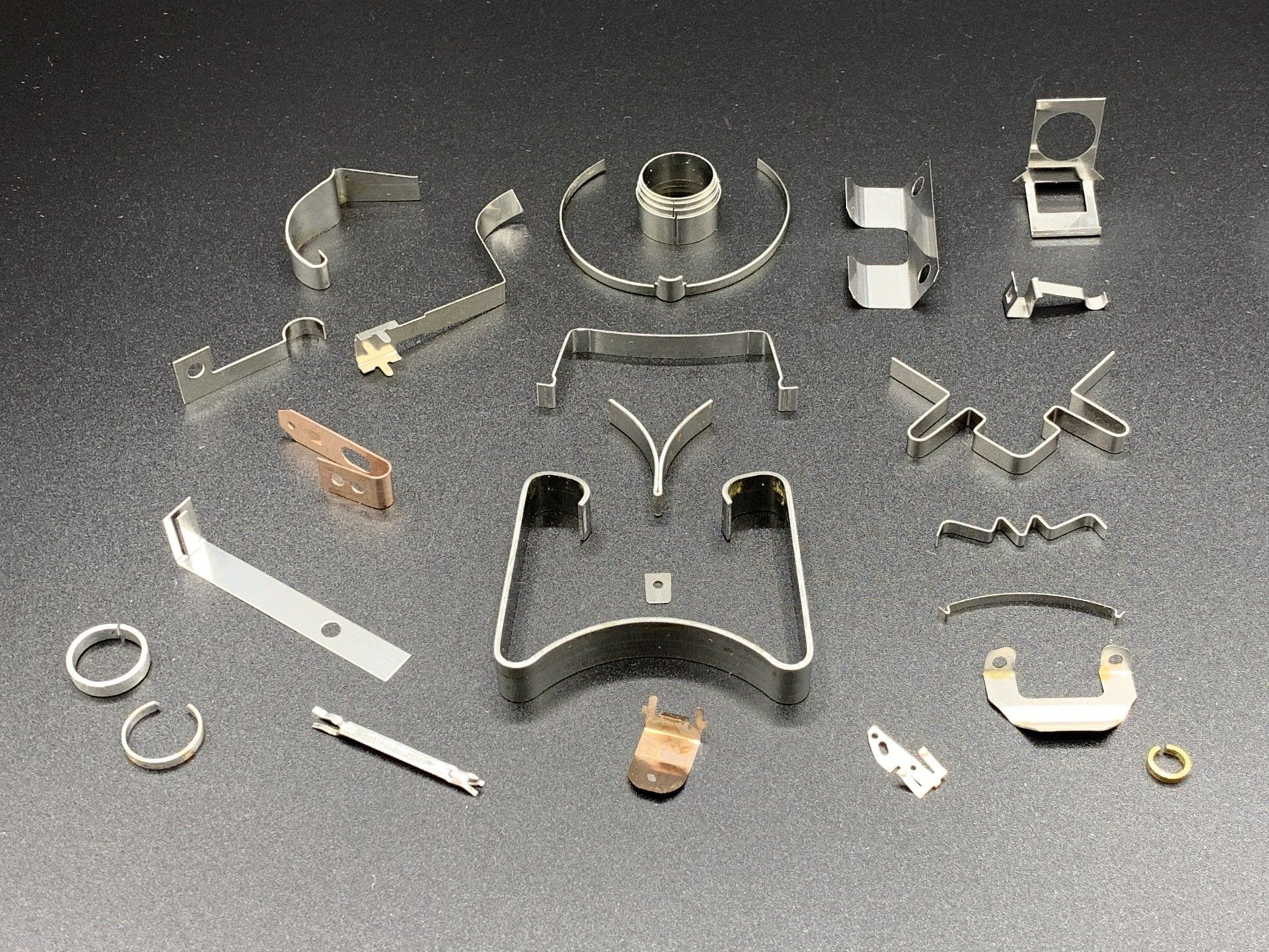 A bunch of metal parts are sitting on a table