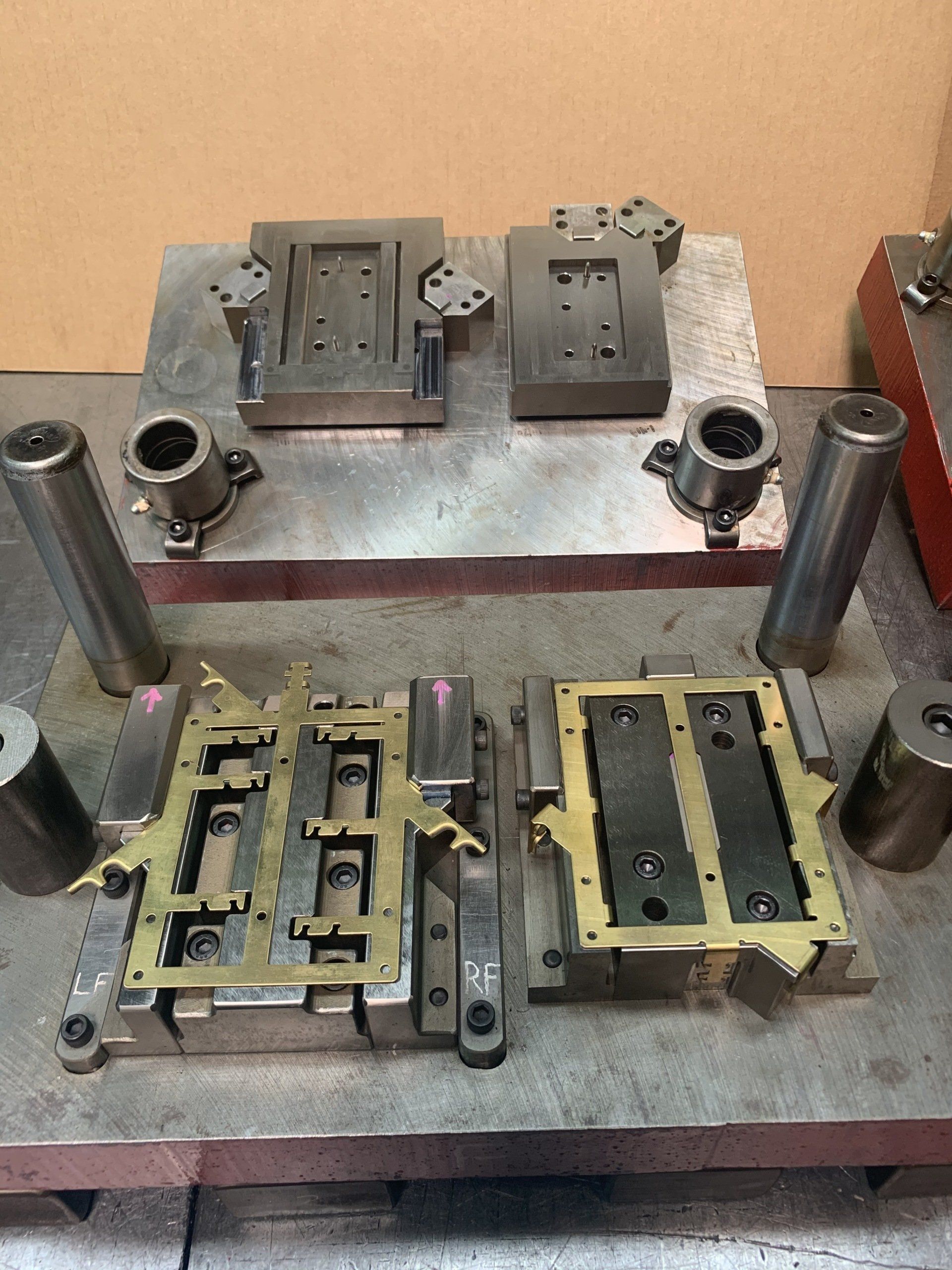 Two pieces of metal are sitting on top of each other on a table.