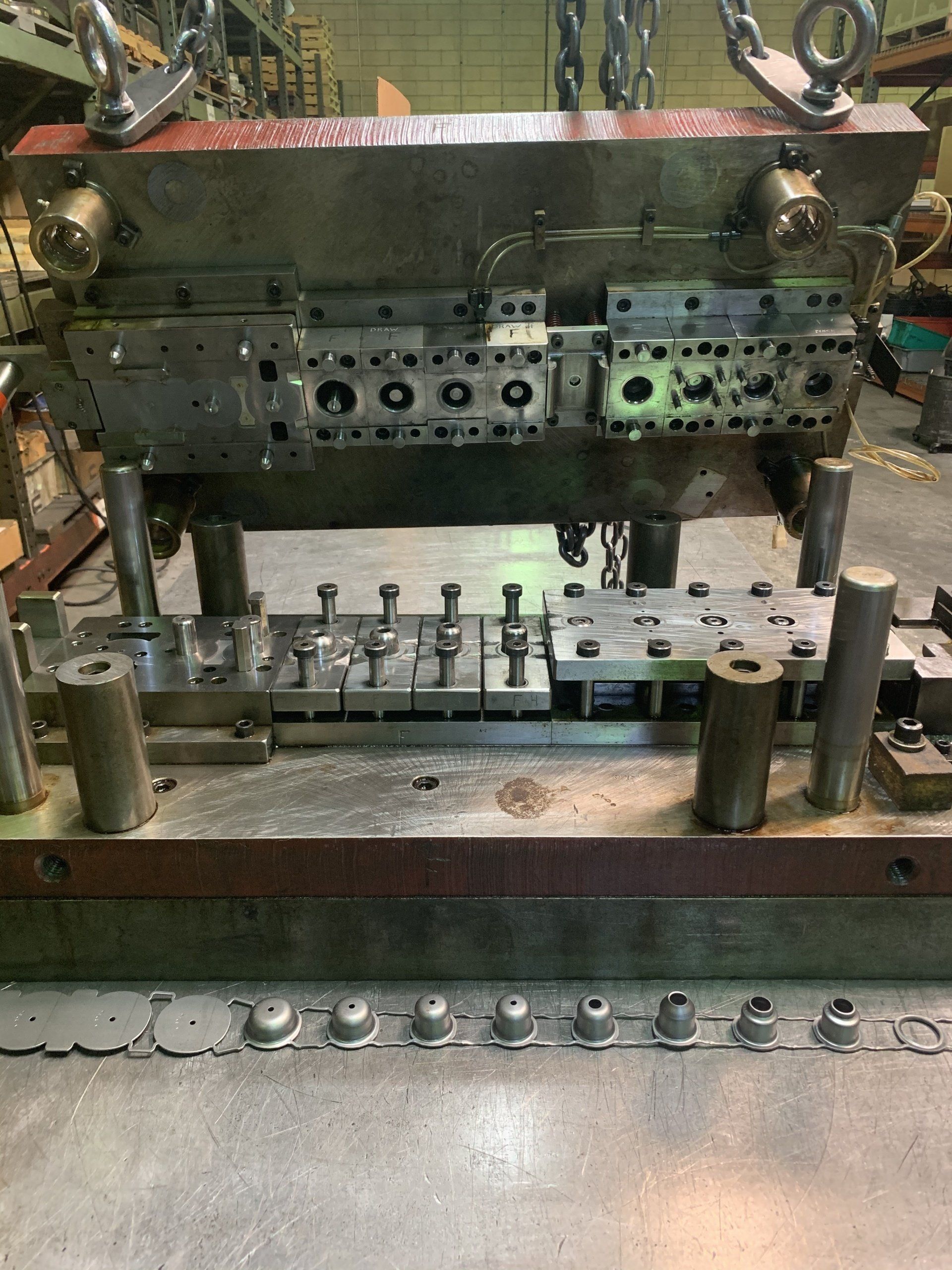 A machine is sitting on top of a table in a factory.