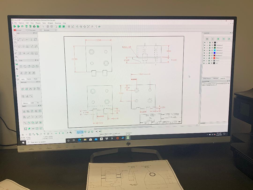 A computer monitor with a drawing of a house on it