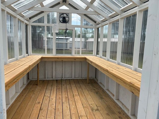 large green house with shelves