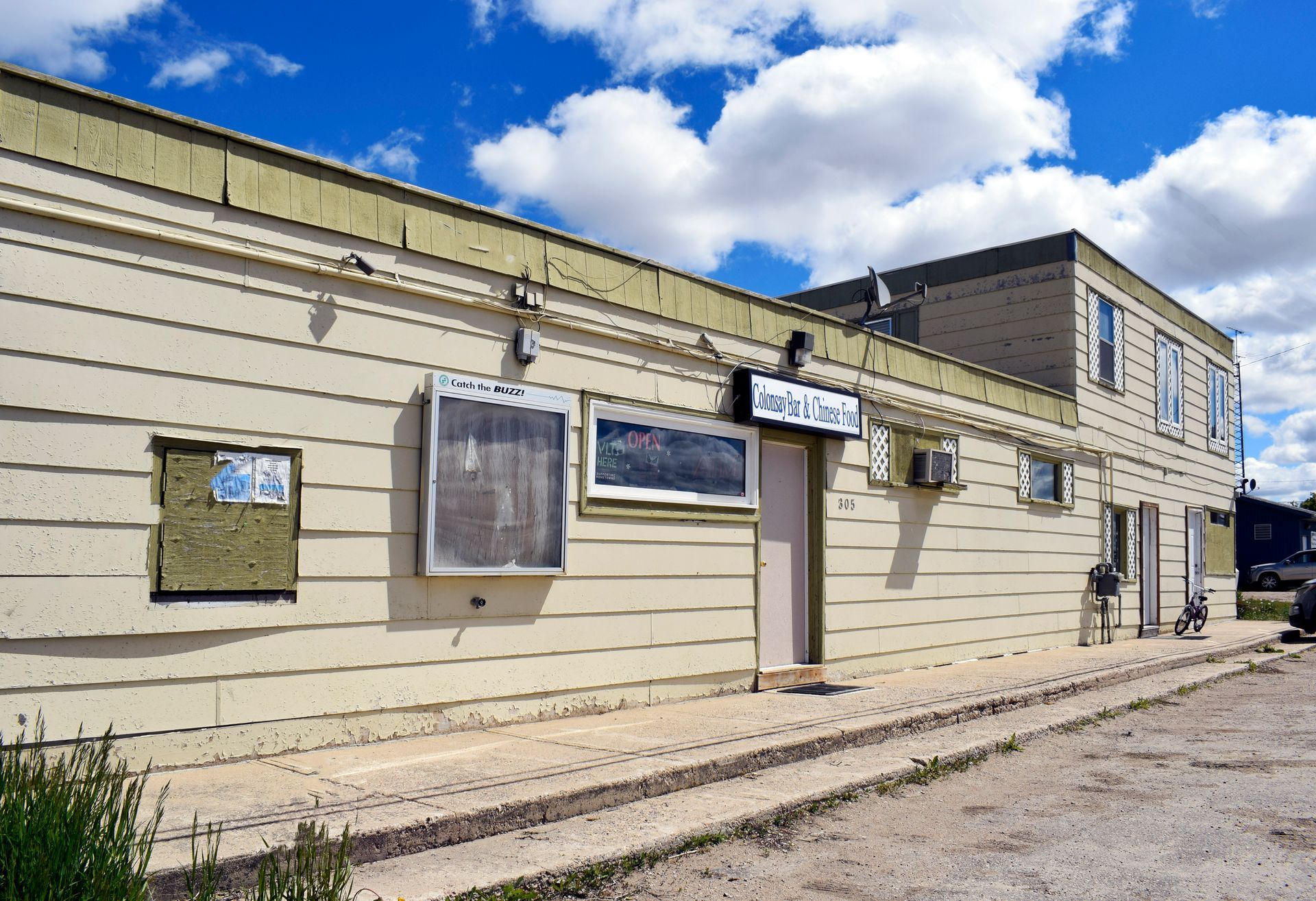 A building with a blue sign that says ' a ' on it
