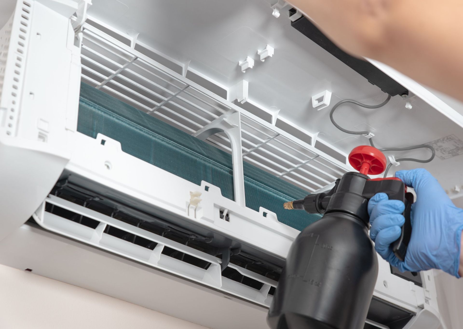 A close up of a dirty air vent in a room.