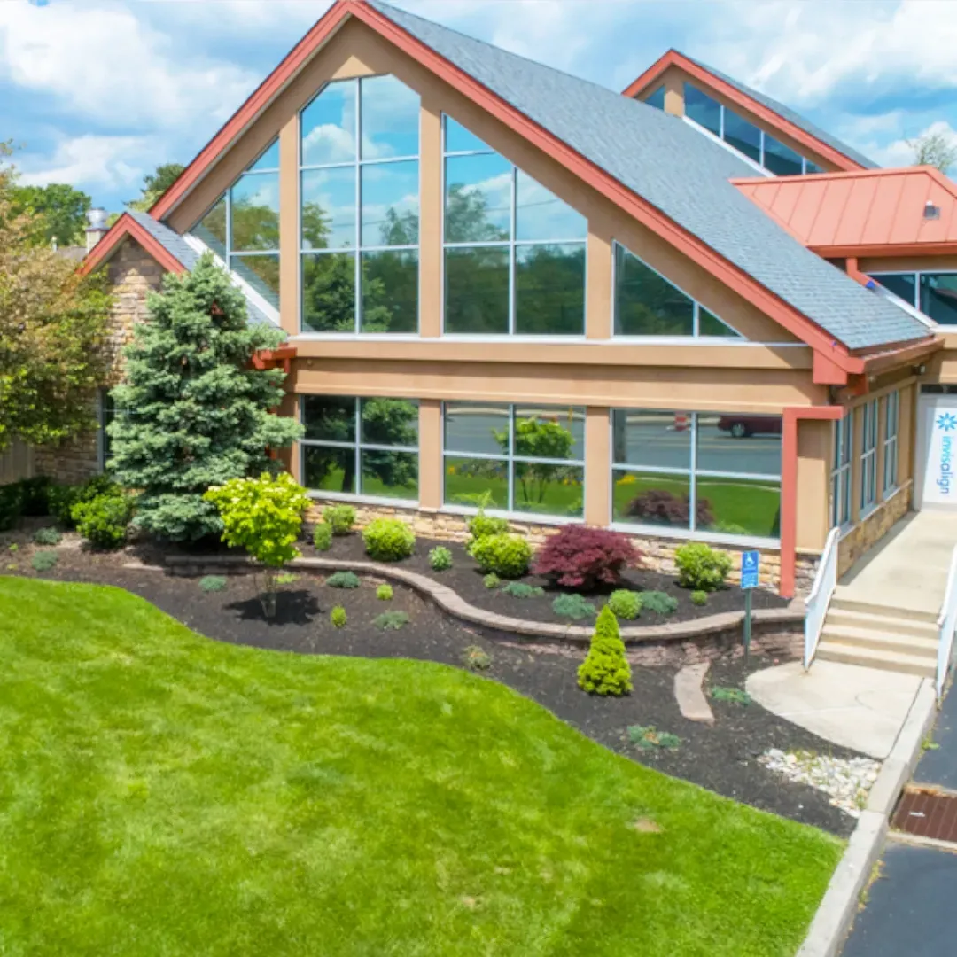 An aerial view of a large house with a lot of windows