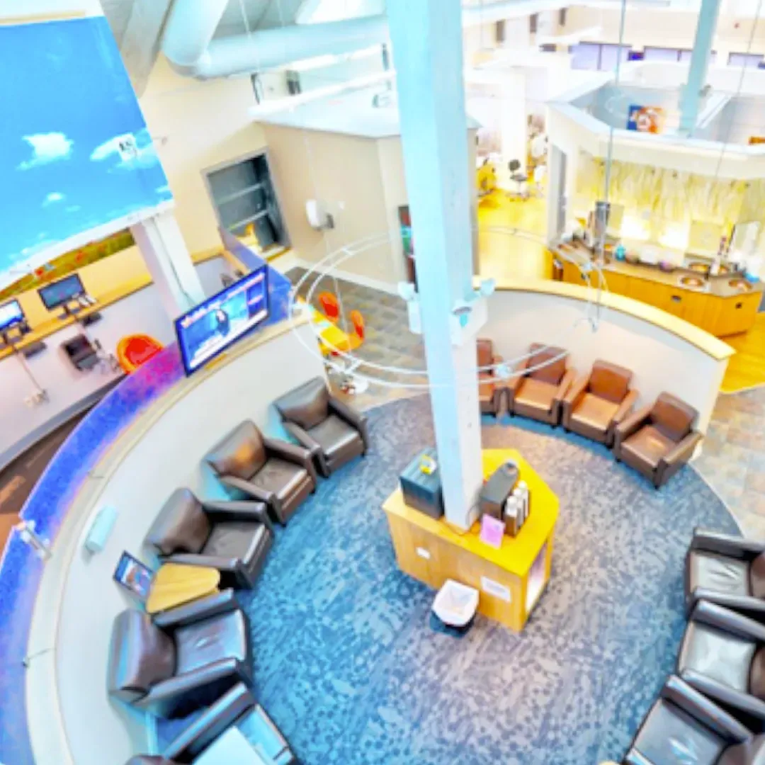 An aerial view of a waiting room with chairs and tables