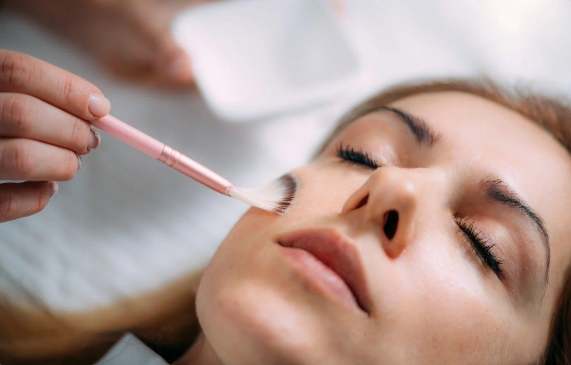 The Skin Studio applying Mandelic acid serum.