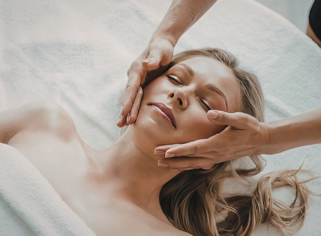 The Skin Studio applying a after care cream a client's face 