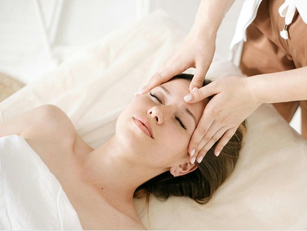 A Lymphatic facial massage on a client's forehead in Nottingham