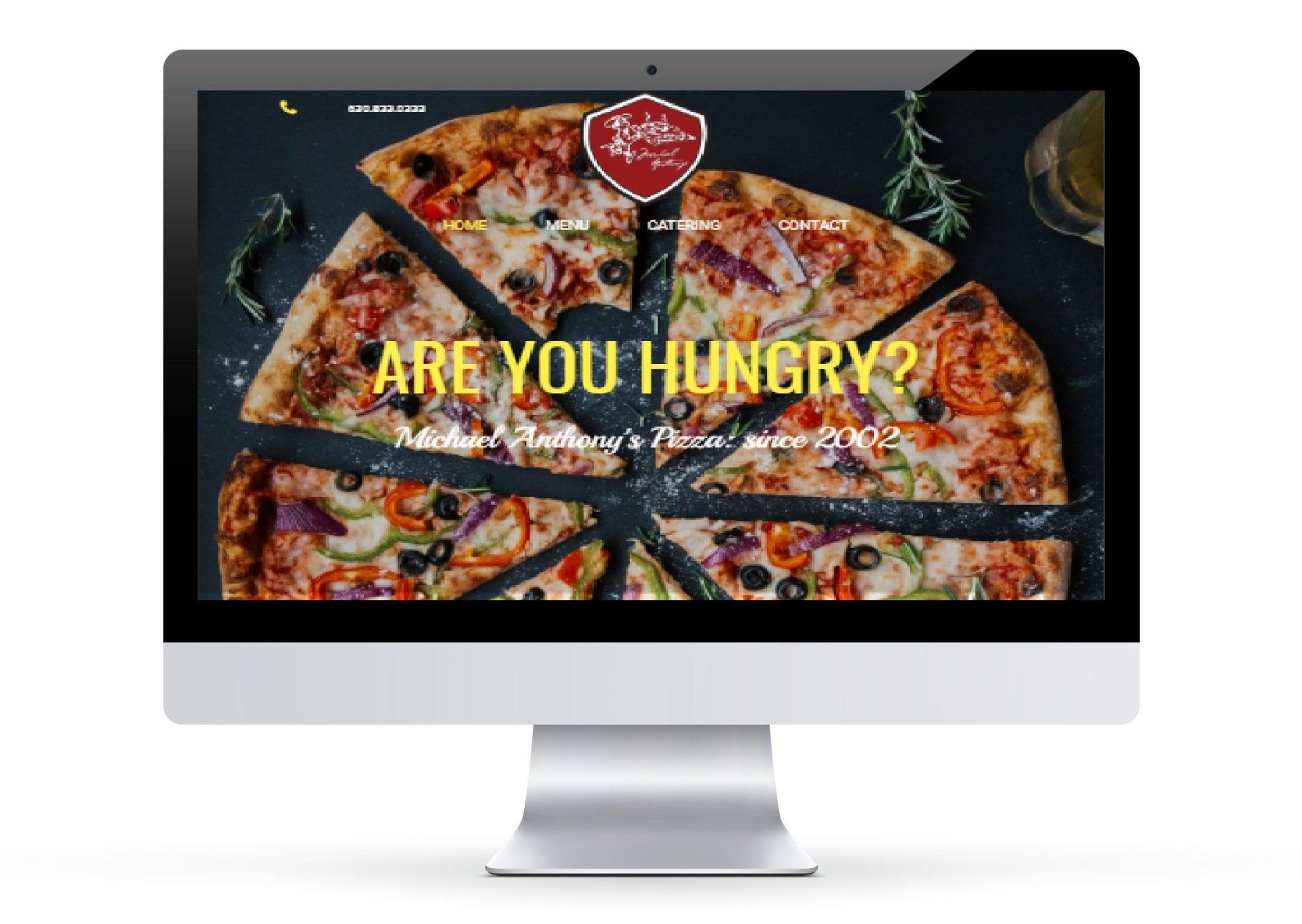 A computer monitor with a pizza on the screen and the words `` are you hungry ''.