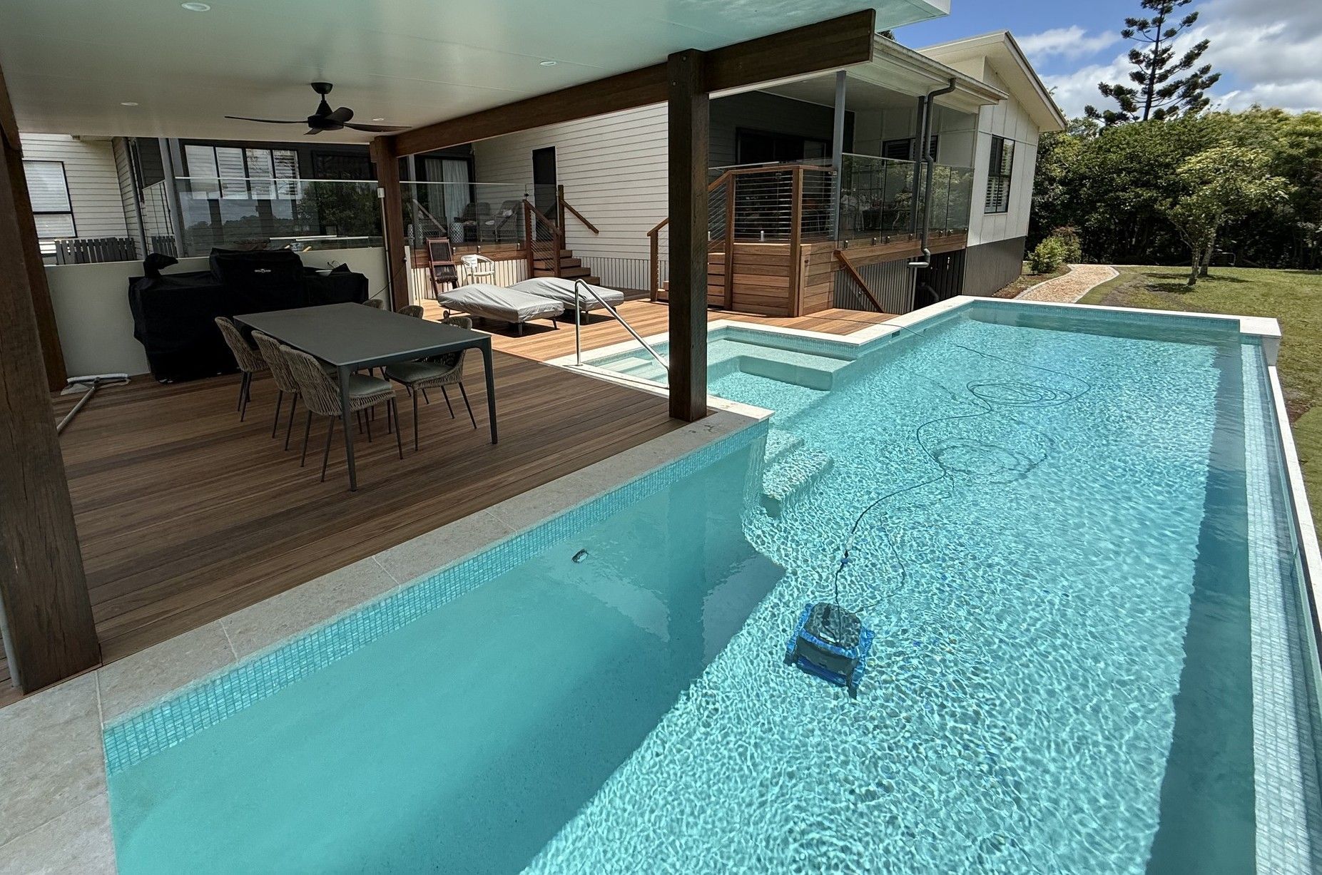 Backyard Pool Beside a Covered Patio — Mad Pool Interiors and Renovations in Baringa, QLD