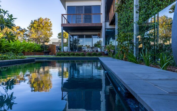 Modern House with A Reflective Swimming Pool — Mad Pool Interiors and Renovations in Baringa, QLD