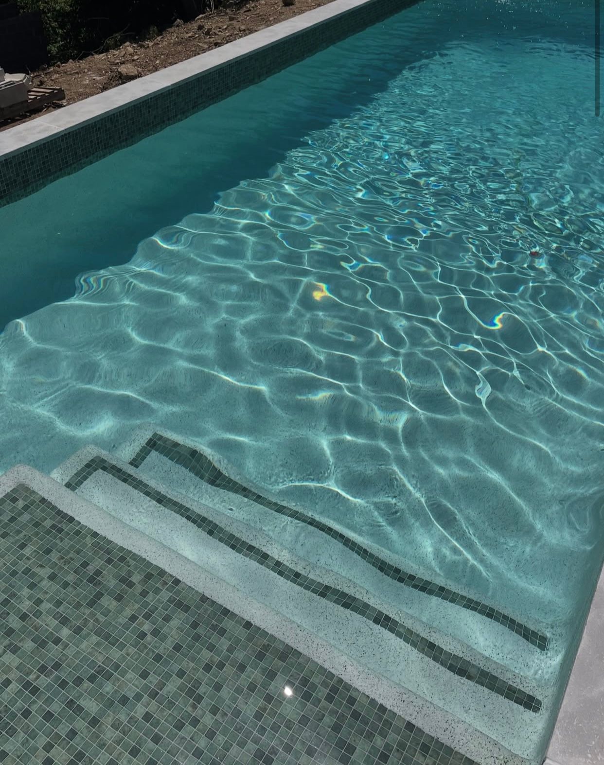Swimming Pool With Submerged Steps — Mad Pool Interiors and Renovations in Baringa, QLD