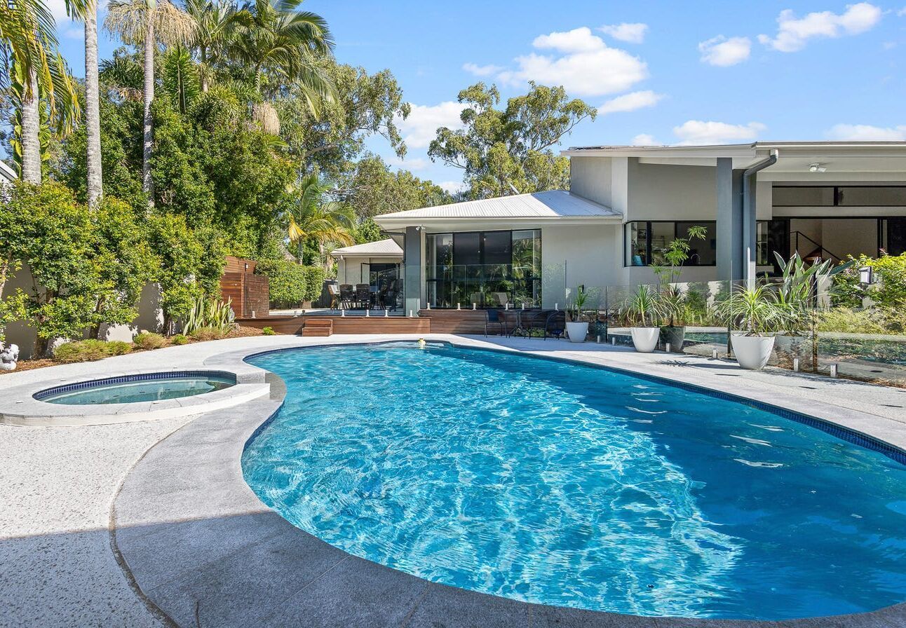 Swimming Pool and Spa in Backyard of a Modern House — Mad Pool Interiors and Renovations in Baringa, QLD