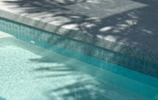 Turquoise Swimming Pool Edge with Tiled Coping — Mad Pool Interiors and Renovations in Baringa, QLD