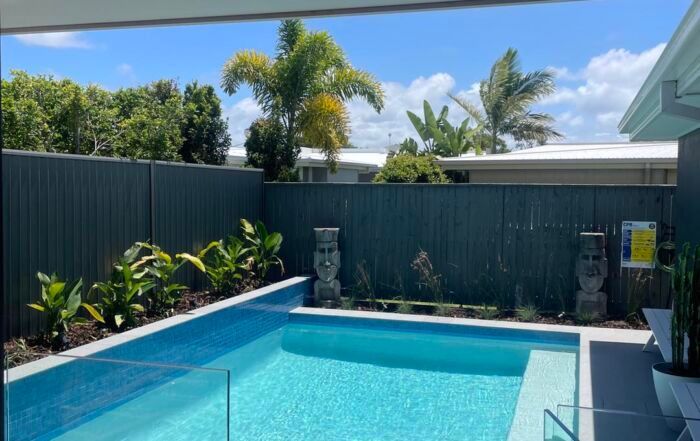 Backyard Pool with Turquoise Water — Mad Pool Interiors and Renovations in Baringa, QLD