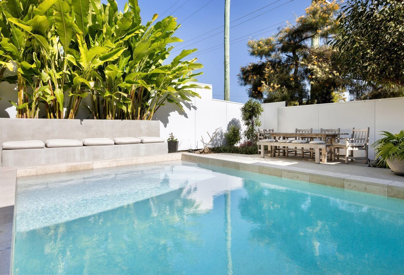 Swimming Pool With Surrounding Patio — Mad Pool Interiors and Renovations in Baringa, QLD