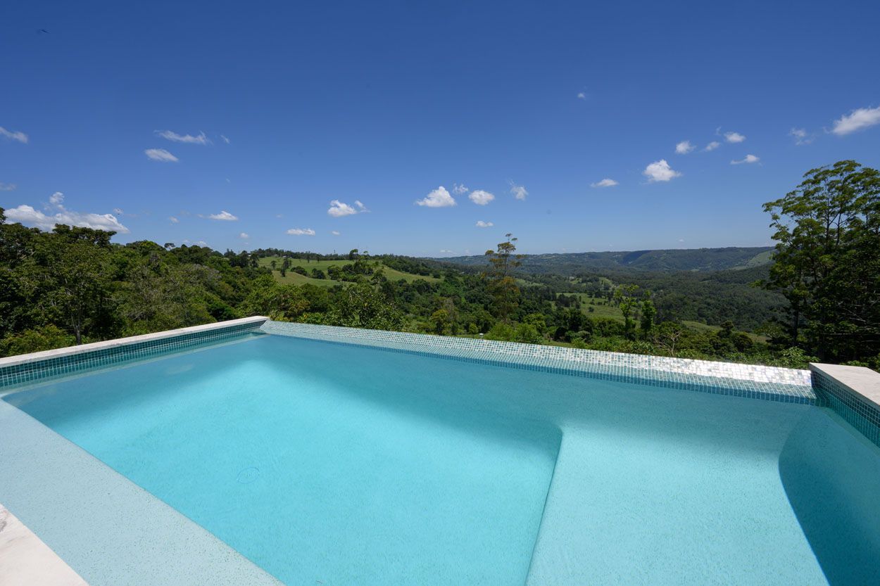 Swimming Pool Overlooking a Lush Valley — Mad Pool Interiors and Renovations in Baringa, QLD