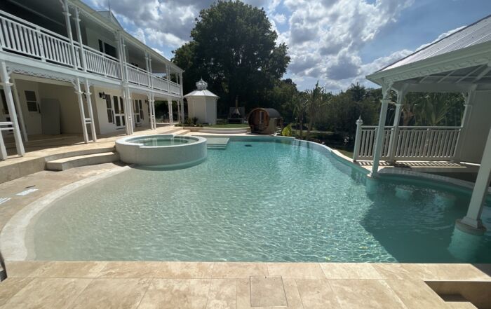 Luxury Backyard Pool with A Raised Spa — Mad Pool Interiors and Renovations in Baringa, QLD