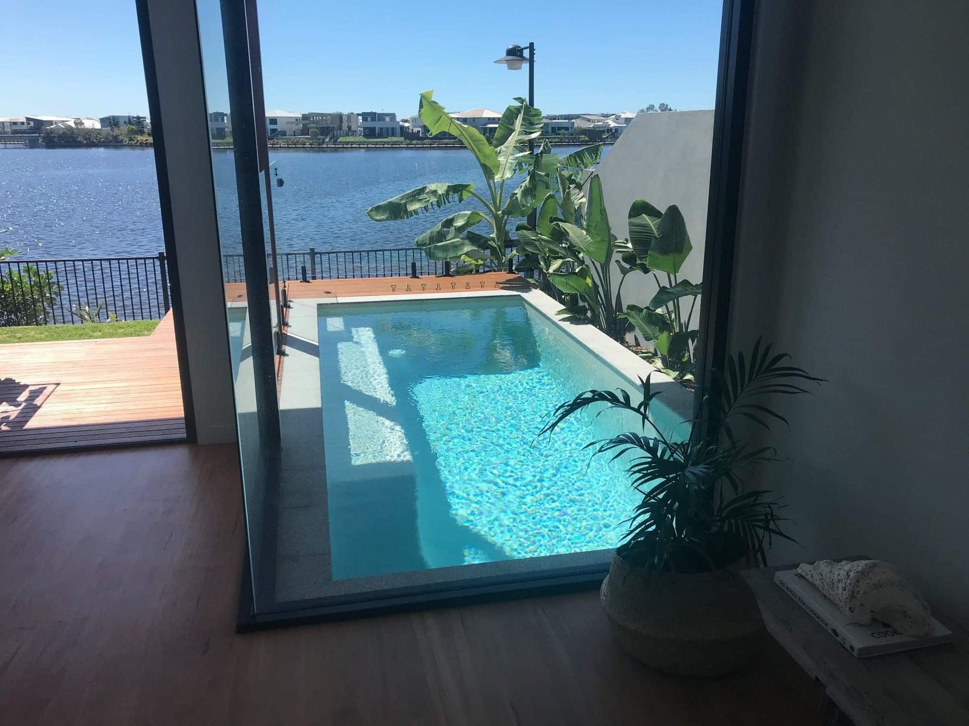 Poolside Interior With Lake View — Mad Pool Interiors and Renovations in Baringa, QLD