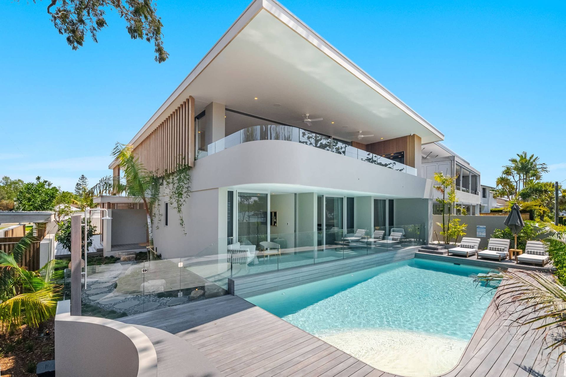 Modern Two-story House With a Pool — Mad Pool Interiors and Renovations in Baringa, QLD