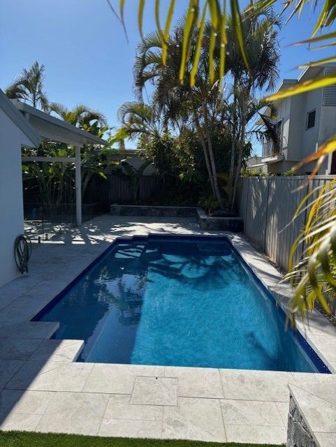 Backyard Swimming Pool Beside a House — Mad Pool Interiors and Renovations in Baringa, QLD