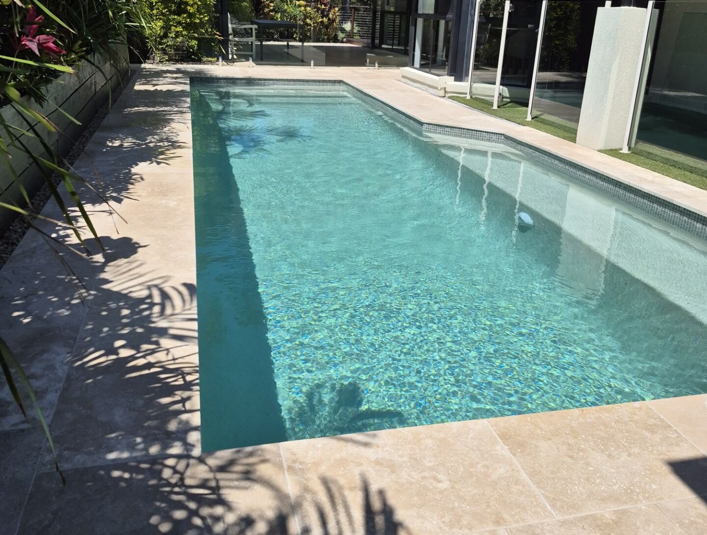 Sunny Rectangular Outdoor Swimming Pool With Clear Blue Water — Mad Pool Interiors and Renovations in Baringa, QLD