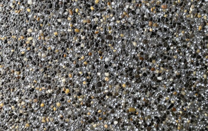 Close-Up of Gray and Black Pebbled Gravel with Scattered Tan Stones — Mad Pool Interiors and Renovations in Baringa, QLD