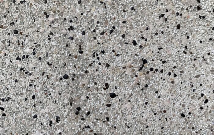 Gray Speckled Stone or Terrazzo Surface with Black Flecks — Mad Pool Interiors and Renovations in Baringa, QLD