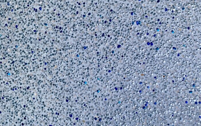 Close-Up of A Light Gray Speckled Surface with Scattered Blue and Black Dots — Mad Pool Interiors and Renovations in Baringa, QLD