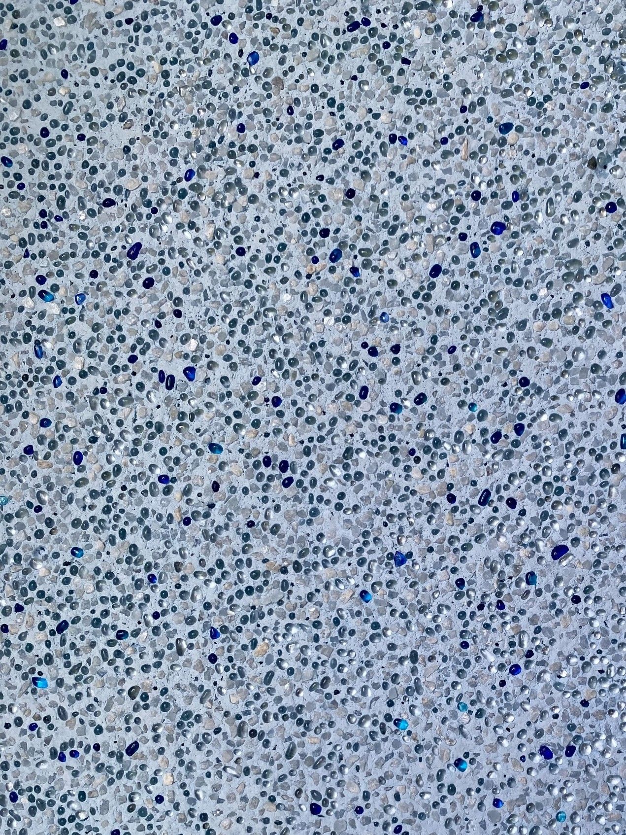 Close-up of Light Gray Surface Speckled With Tiny Blue and Silver Dots — Mad Pool Interiors and Renovations in Baringa, QLD