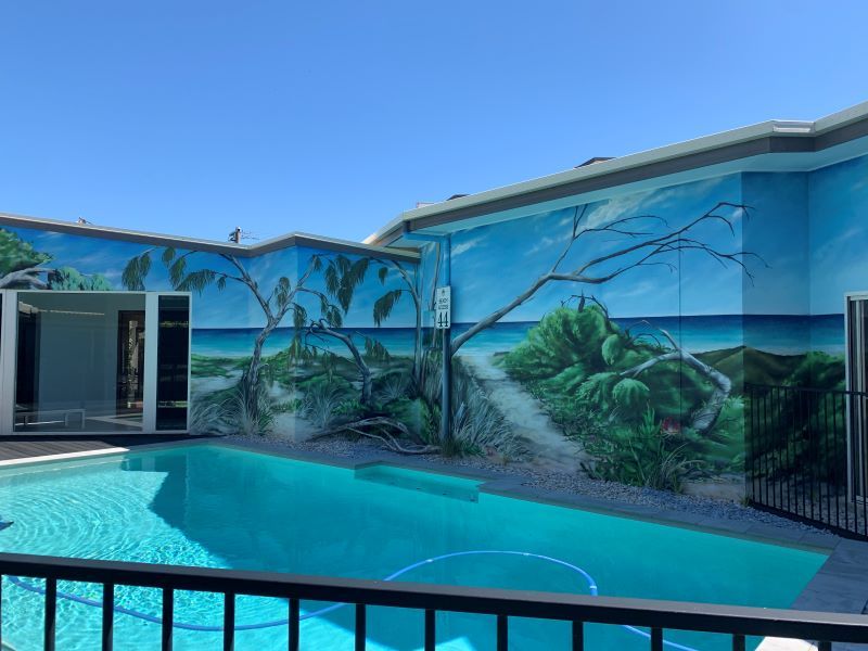 Pool With Mural of a Beach Scene on the Surrounding Walls — Mad Pool Interiors and Renovations in Baringa, QLD
