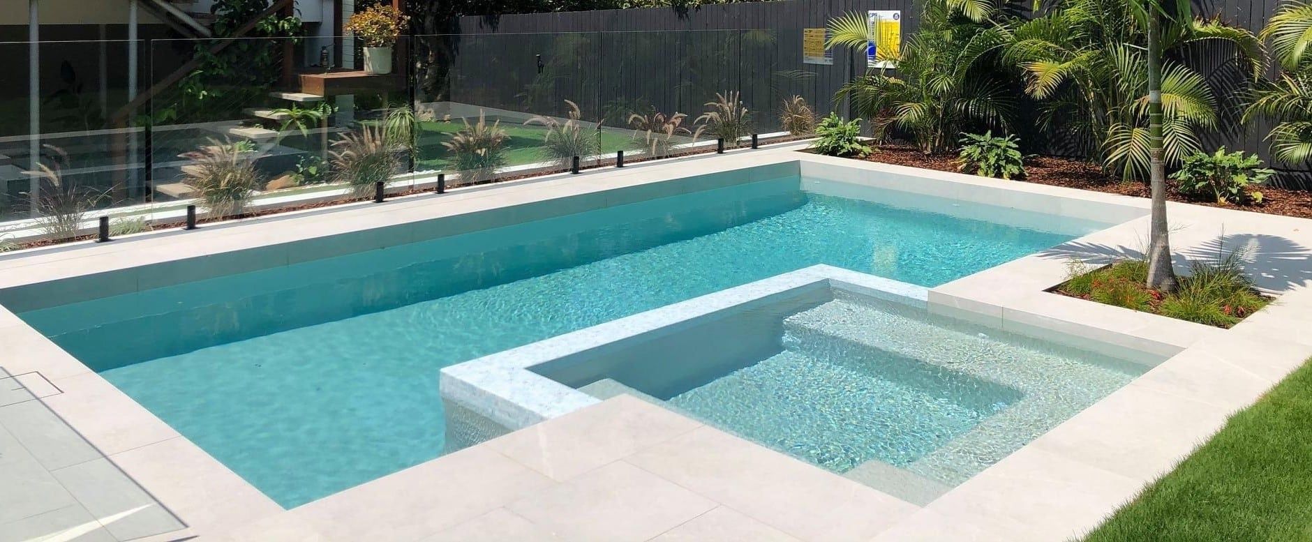 A Rectangular Swimming Pool With a Spa — Mad Pool Interiors and Renovations in Baringa, QLD
