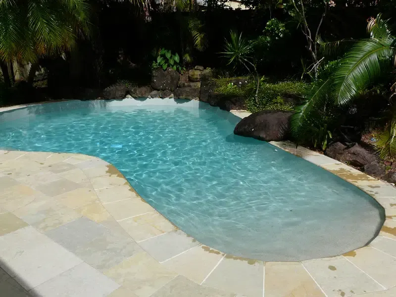 Curved Backyard Pool — Mad Pool Interiors and Renovations in Baringa, QLD