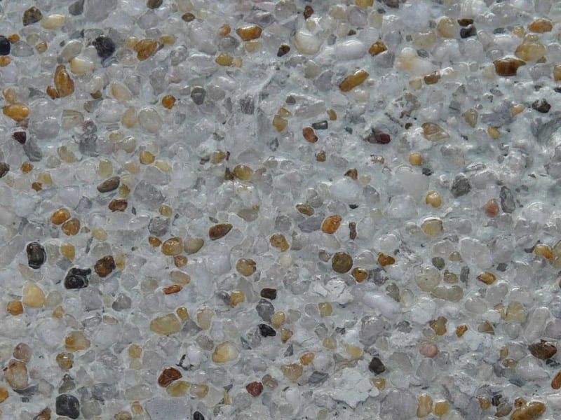 Close-up of a Speckled Concrete Surface With Small, Rounded Pebbles — Mad Pool Interiors and Renovations in Baringa, QLD