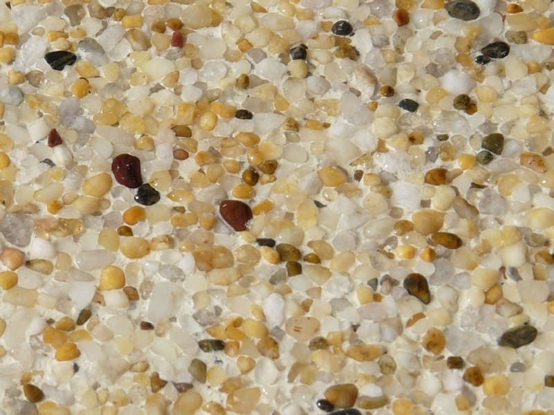 Close-up of a Speckled Beige, Yellow, and Brown Aggregate Surface — Mad Pool Interiors and Renovations in Baringa, QLD