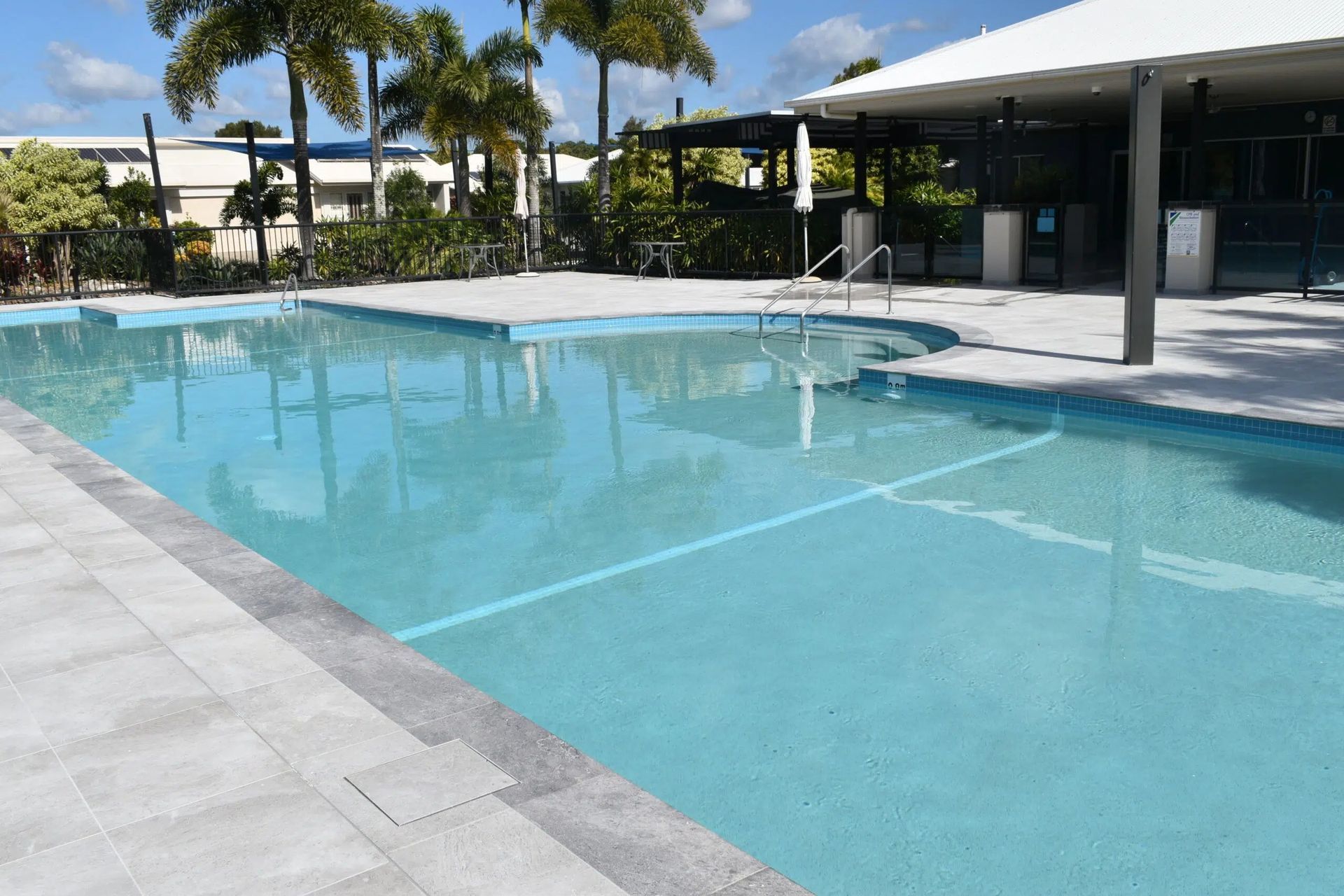 Outdoor Swimming Pool With Modern Lounge Area — Mad Pool Interiors and Renovations in Baringa, QLD