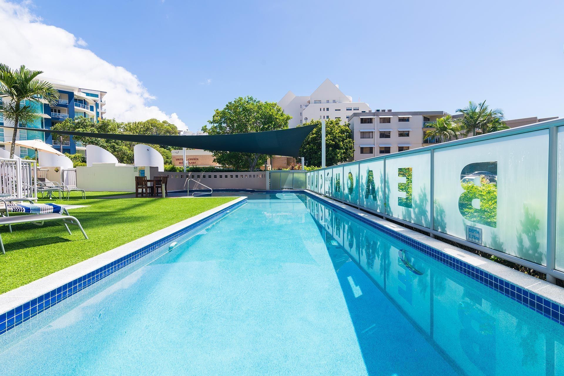 Outdoor Hotel Pool With Blue Water — Mad Pool Interiors and Renovations in Baringa, QLD